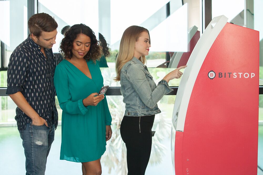 People queue at a Bitcoin ATM